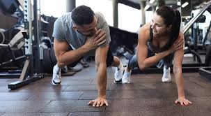 Toning Bingo Wings: Your Ultimate Guide to Sculpting Sleek Arms at the Gym 3 Fitness trainer demonstrating arm toning exercises Falkirk
