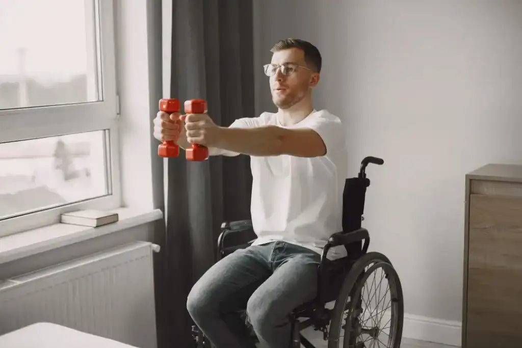 Image of man doing exercise in his wheelchair to aid weight loss Falkirk