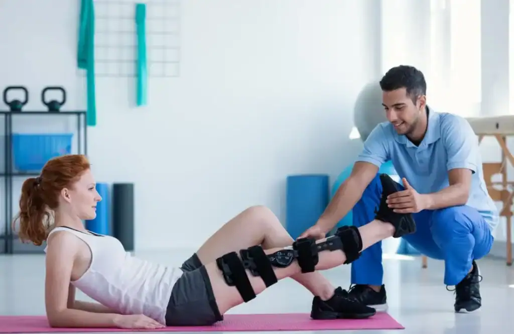 Woman having treatment to help muscle recovery Falkirk after an injury